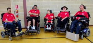 Members of the Western Knights Powerchair team, including Kyle Scolari (second from right)